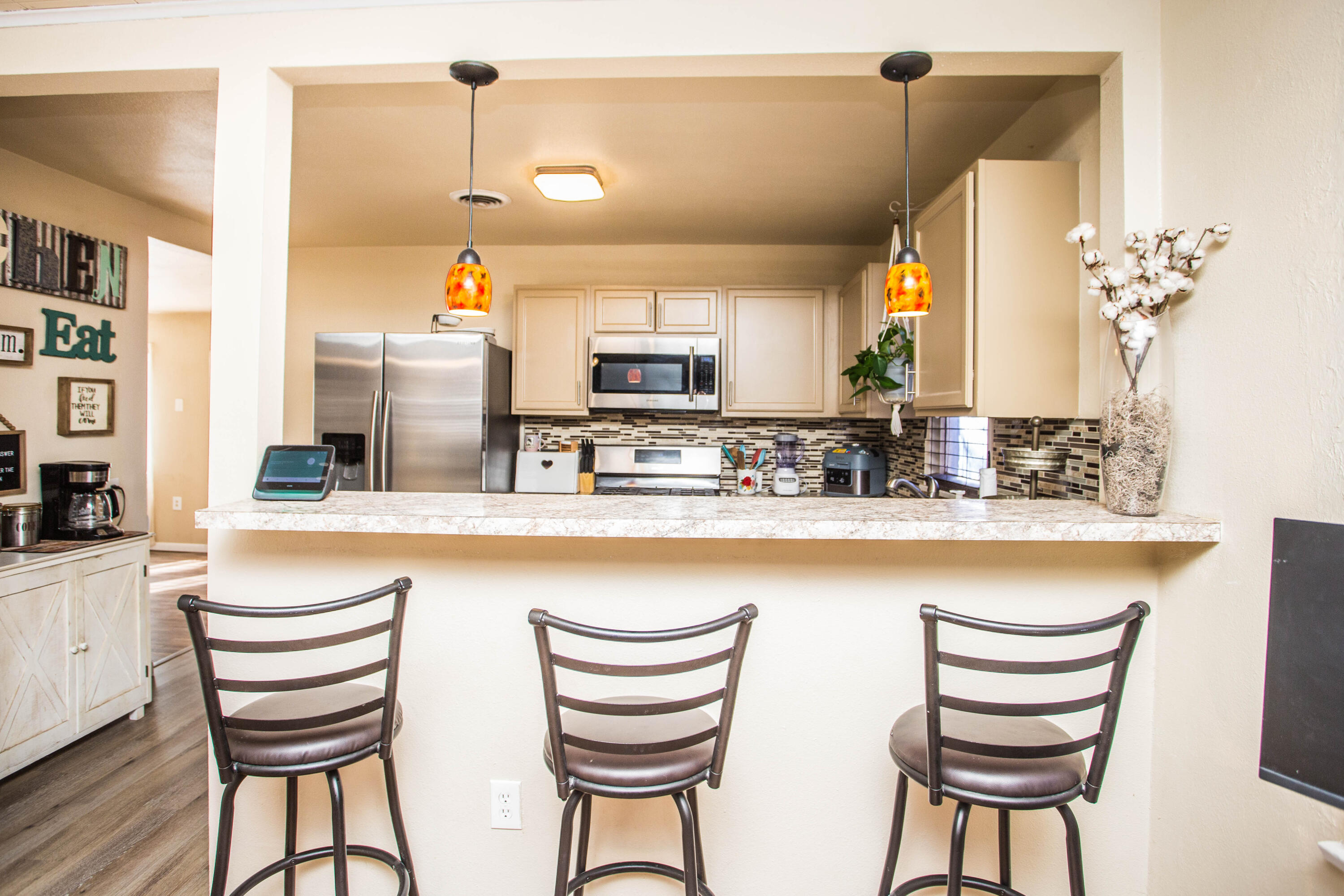 2103 30th Street Lubbock, TX 79411 - Photo 7 of 15 a kitchen with stainless steel appliances a sink and a refrigerator