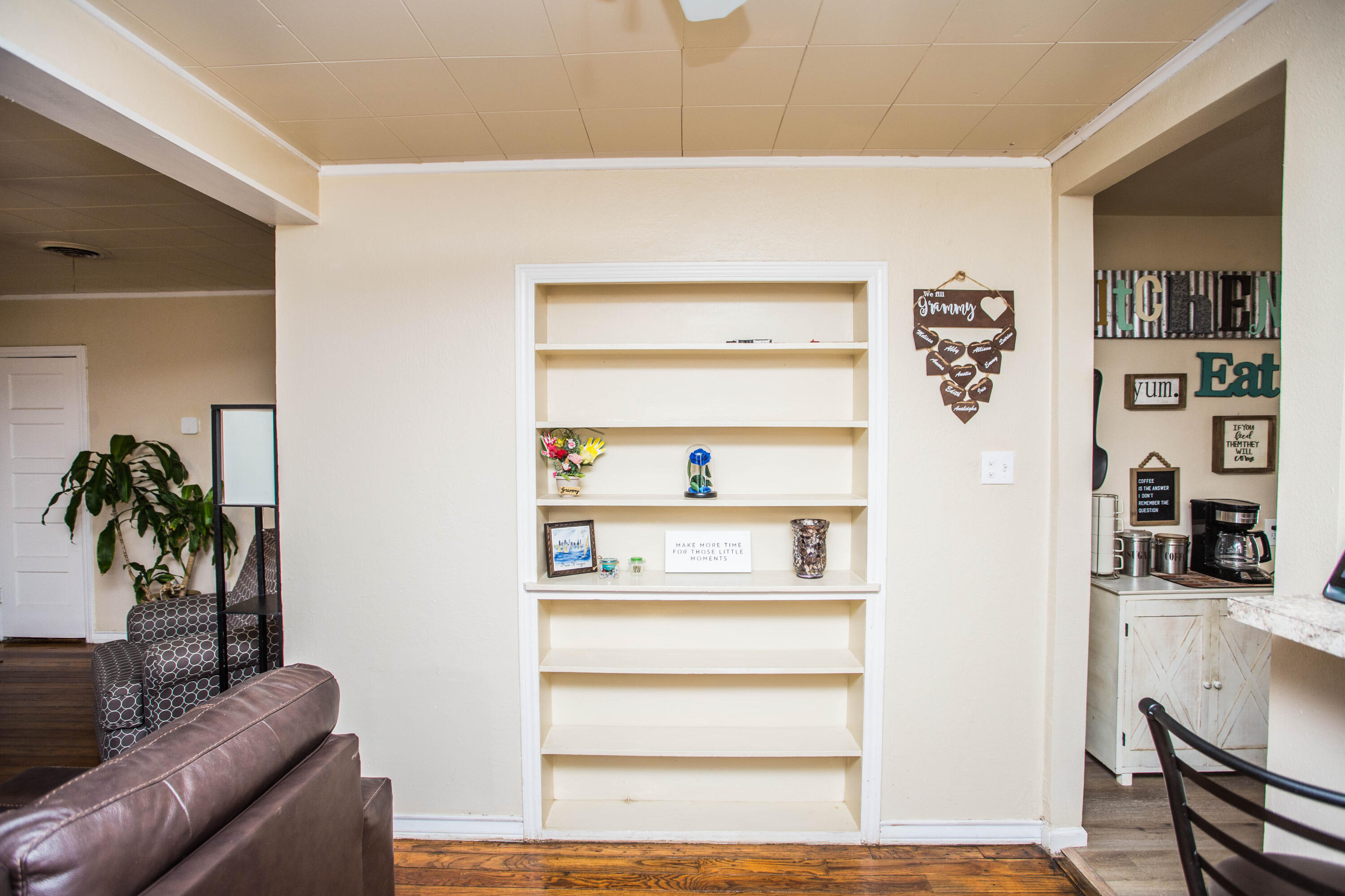 2103 30th Street Lubbock, TX 79411 - Photo 8 of 15 a living room with furniture and a potted plant