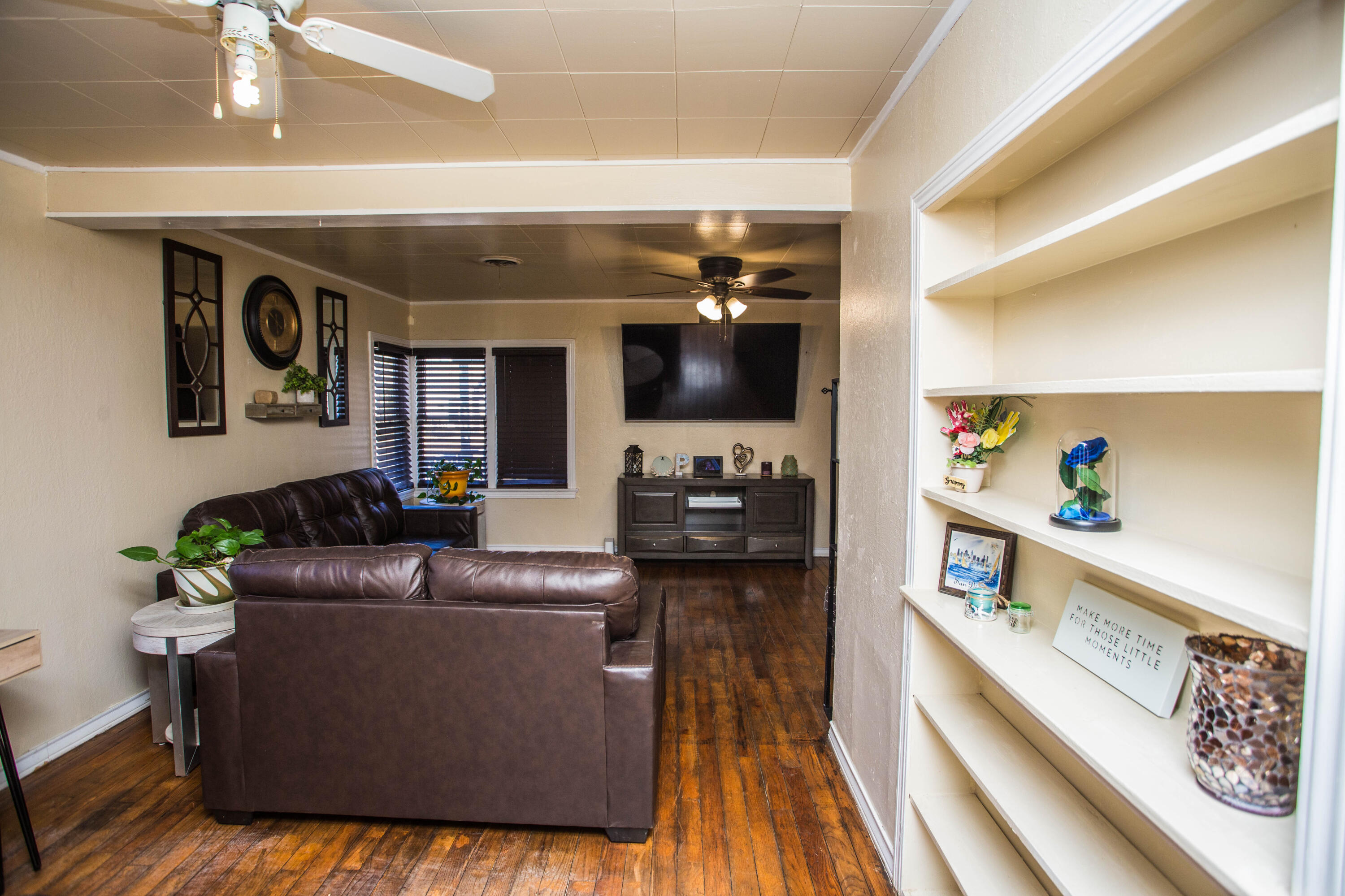 2103 30th Street Lubbock, TX 79411 - Photo 9 of 15 a living room with furniture and a flat screen tv