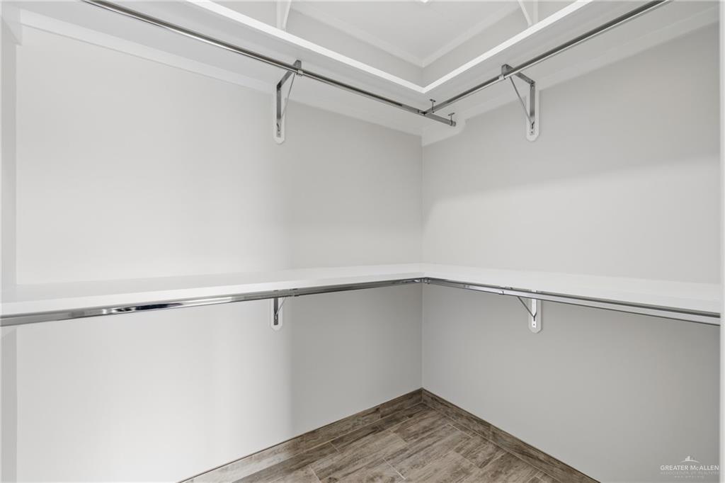 710 West 25th Street Mission, TX 78574 - Photo 12 of 15 a view of a room with racks on the wall