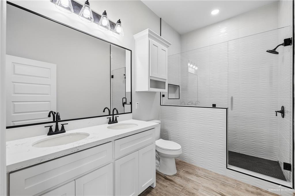 710 West 25th Street Mission, TX 78574 - Photo 15 of 15 a bathroom with a sink a toilet and shower