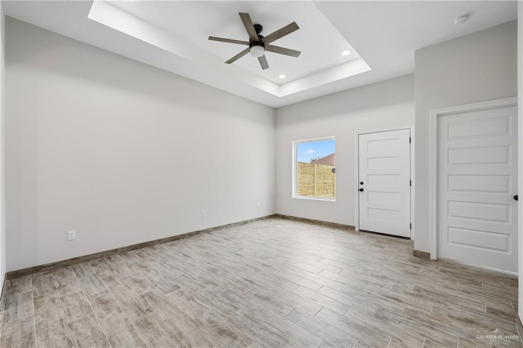 710 West 25th Street Mission, TX 78574 - Photo 3 of 15 an empty room with closet and a ceiling fan