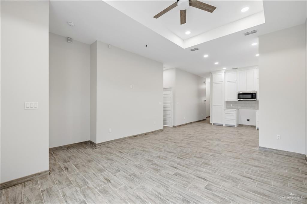 710 West 25th Street Mission, TX 78574 - Photo 6 of 15 a view of a kitchen with a sink and a refrigerator