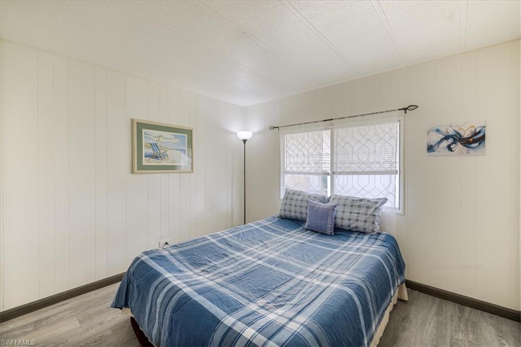 952 Days Lane North Fort Myers, FL 33917 - Photo 11 of 46 a bedroom with a large bed and a window