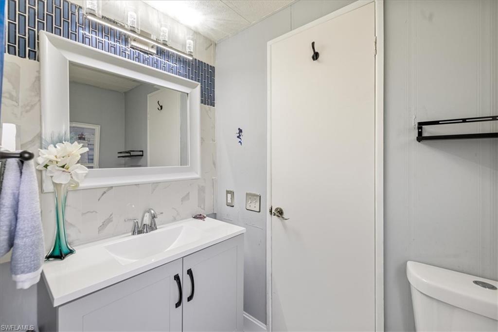 952 Days Lane North Fort Myers, FL 33917 - Photo 16 of 46 a bathroom with a sink a toilet and shower