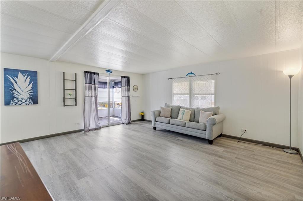 952 Days Lane North Fort Myers, FL 33917 - Photo 19 of 46 a living room with furniture and wooden floor