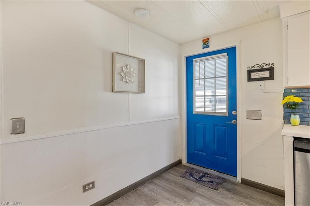 952 Days Lane North Fort Myers, FL 33917 - Photo 2 of 46 a view of an entryway with wooden floor