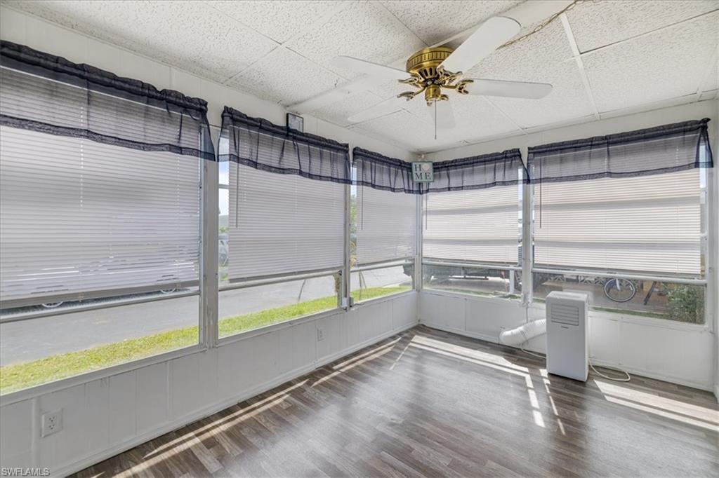 952 Days Lane North Fort Myers, FL 33917 - Photo 21 of 46 a room with gym equipment and a ceiling fan