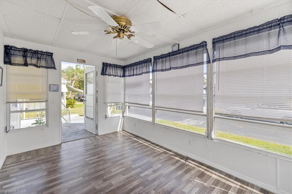 952 Days Lane North Fort Myers, FL 33917 - Photo 22 of 46 a view of an empty room with a window and wooden floor