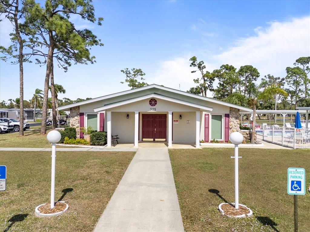952 Days Lane North Fort Myers, FL 33917 - Photo 27 of 46 a front view of a house with a yard and garage