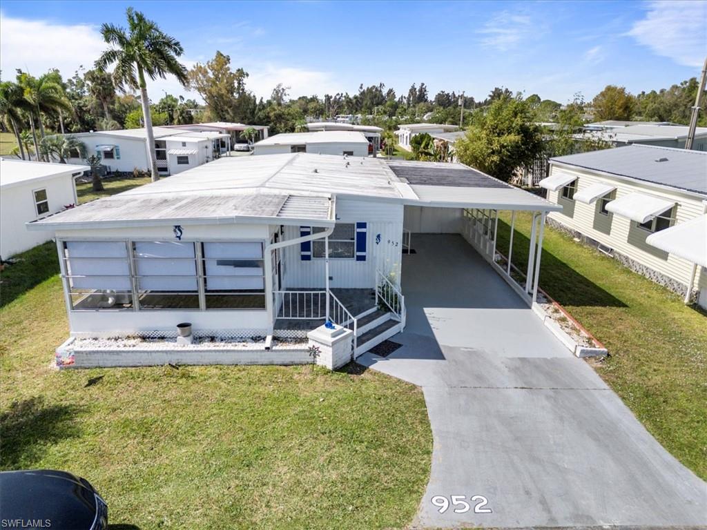 952 Days Lane North Fort Myers, FL 33917 - Photo 46 of 46 a view of a house with pool porch and chairs