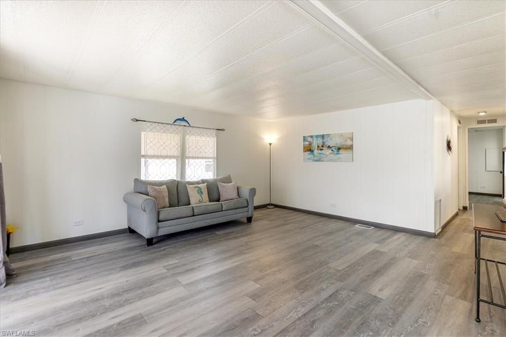 952 Days Lane North Fort Myers, FL 33917 - Photo 8 of 46 a living room with furniture and a window