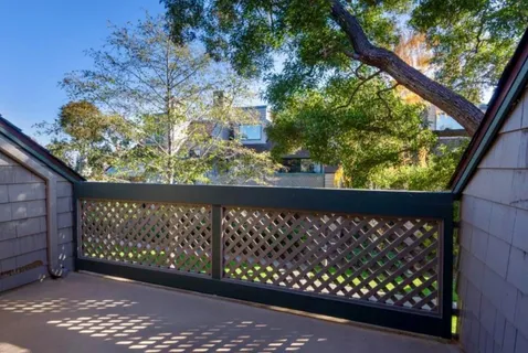 a view of a street view from a balcony