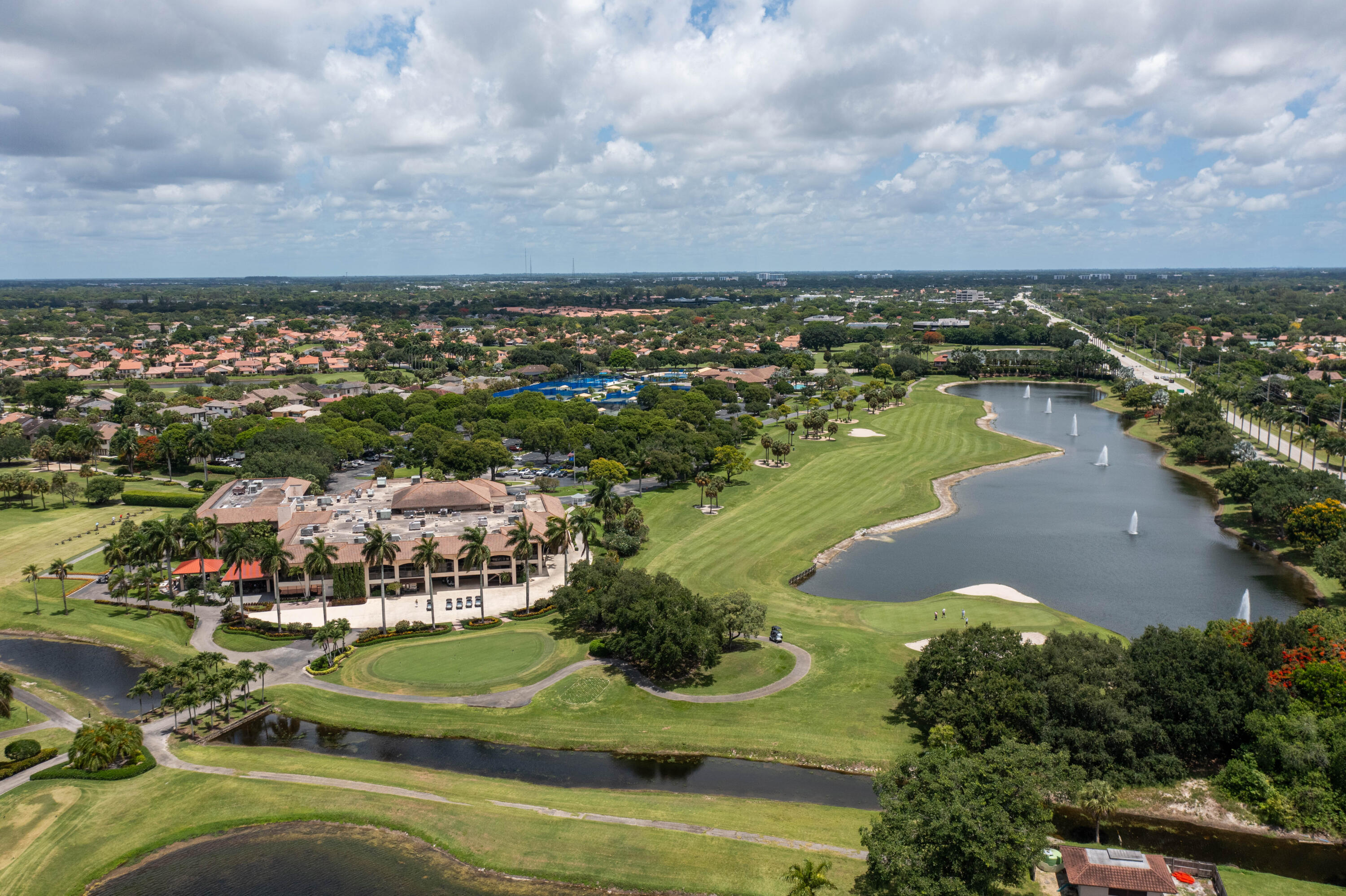 7520 La Paz Boulevard, Unit 104 Boca Raton, FL 33433 - Photo 47 of 56 an aerial view of residential houses with outdoor space and trees