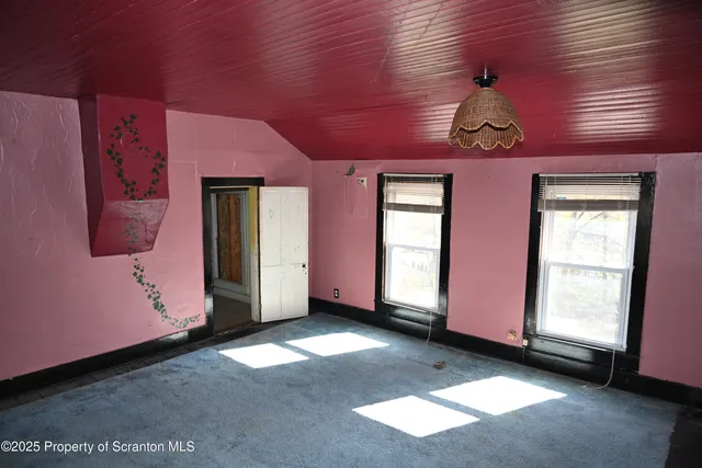 a view of livingroom with furniture and window