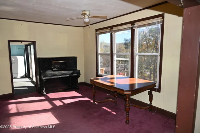 a dining room with a table and chairs