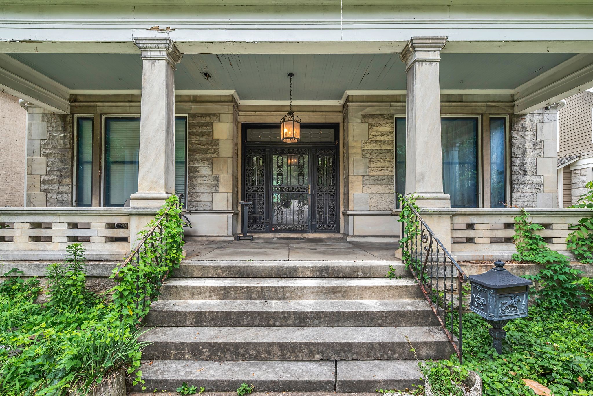 3818 Richland Avenue Nashville, TN 37205 - Photo 3 of 13 a front view of a house with potted plants and wooden floor
