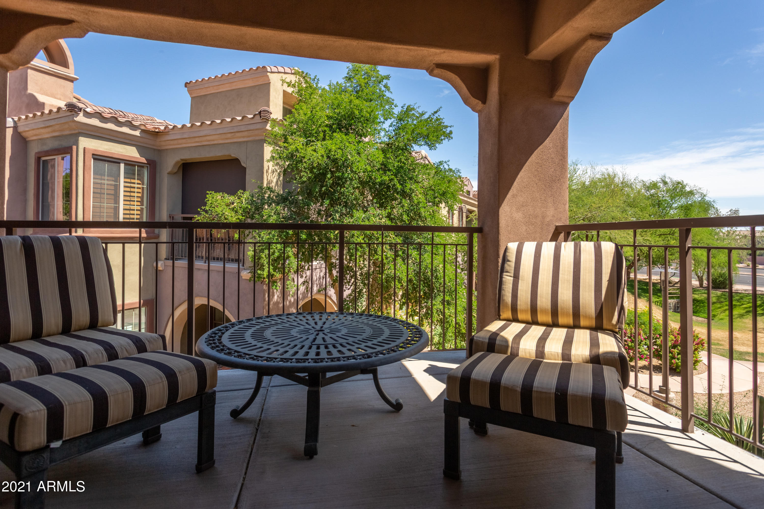 3935 East Rough Rider Road, Unit 1192 Phoenix, AZ 85050 - Photo 3 of 20 a view of balcony with outdoor seating