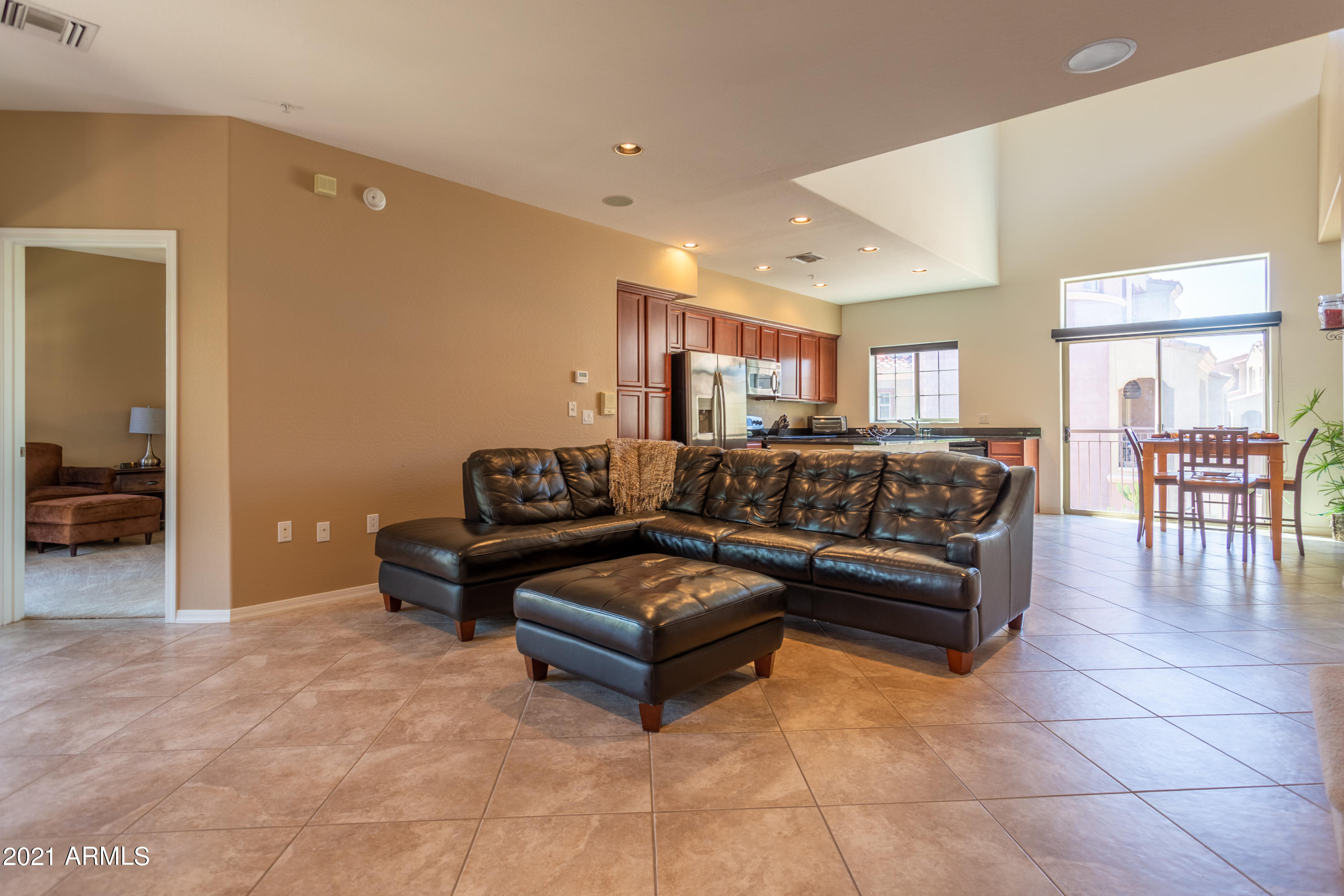 3935 East Rough Rider Road, Unit 1192 Phoenix, AZ 85050 - Photo 7 of 20 a living room with a couch and a coffee table