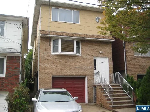 a front view of a house with stairs