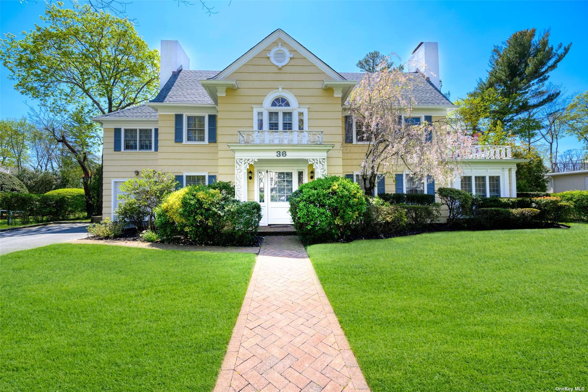 36 Arleigh Road Great Neck, NY 11021 - Photo 1 of 1 a front view of house with yard and green space