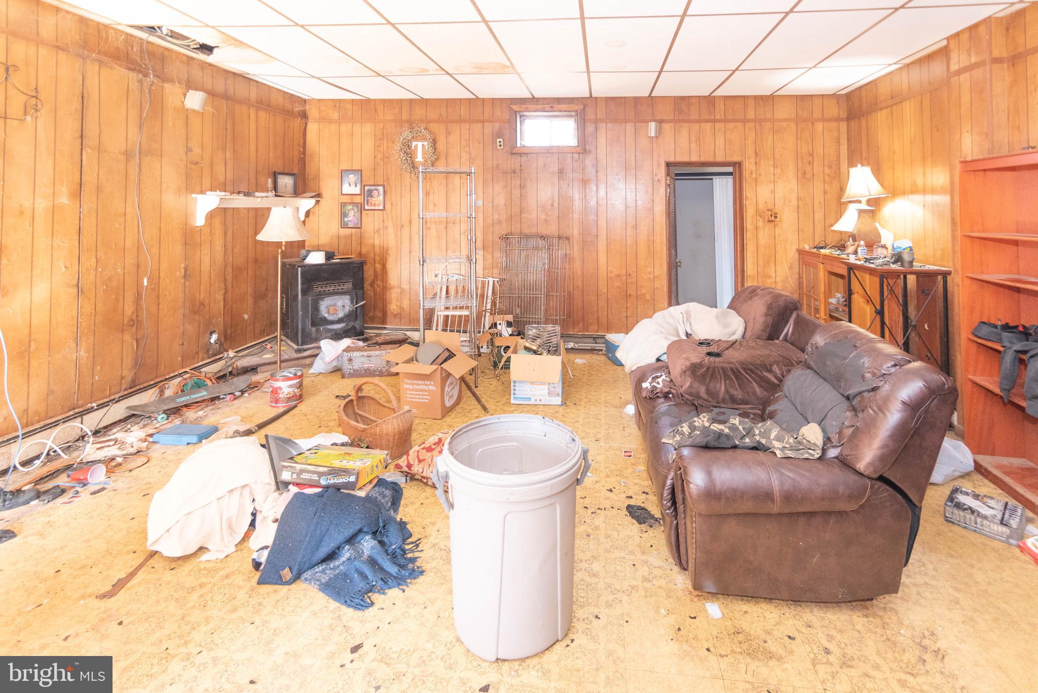 2100 Singerly Road Elkton, MD 21921 - Photo 11 of 67 a living room with furniture and a chandelier
