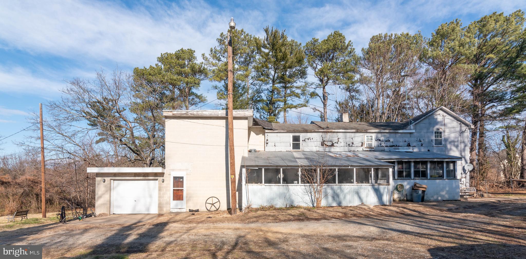 2100 Singerly Road Elkton, MD 21921 - Photo 56 of 67 a front view of a house with a yard and garage