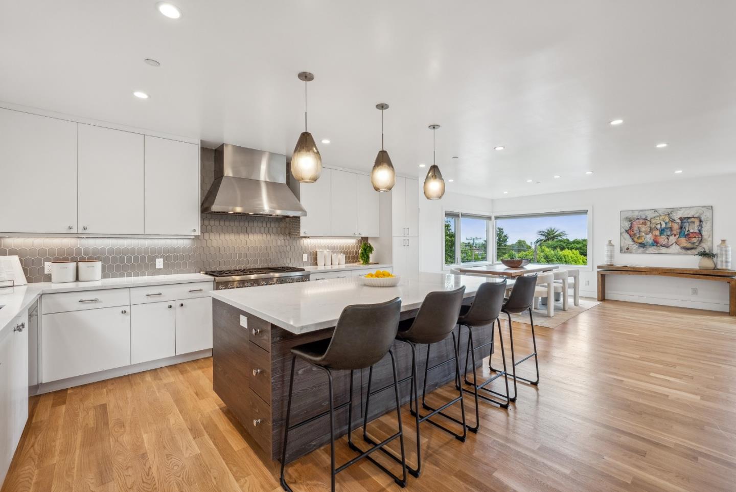 1 Millbrae Circle Millbrae, CA 94030 - Photo 11 of 110 a kitchen with a dining table chairs stove and white cabinets