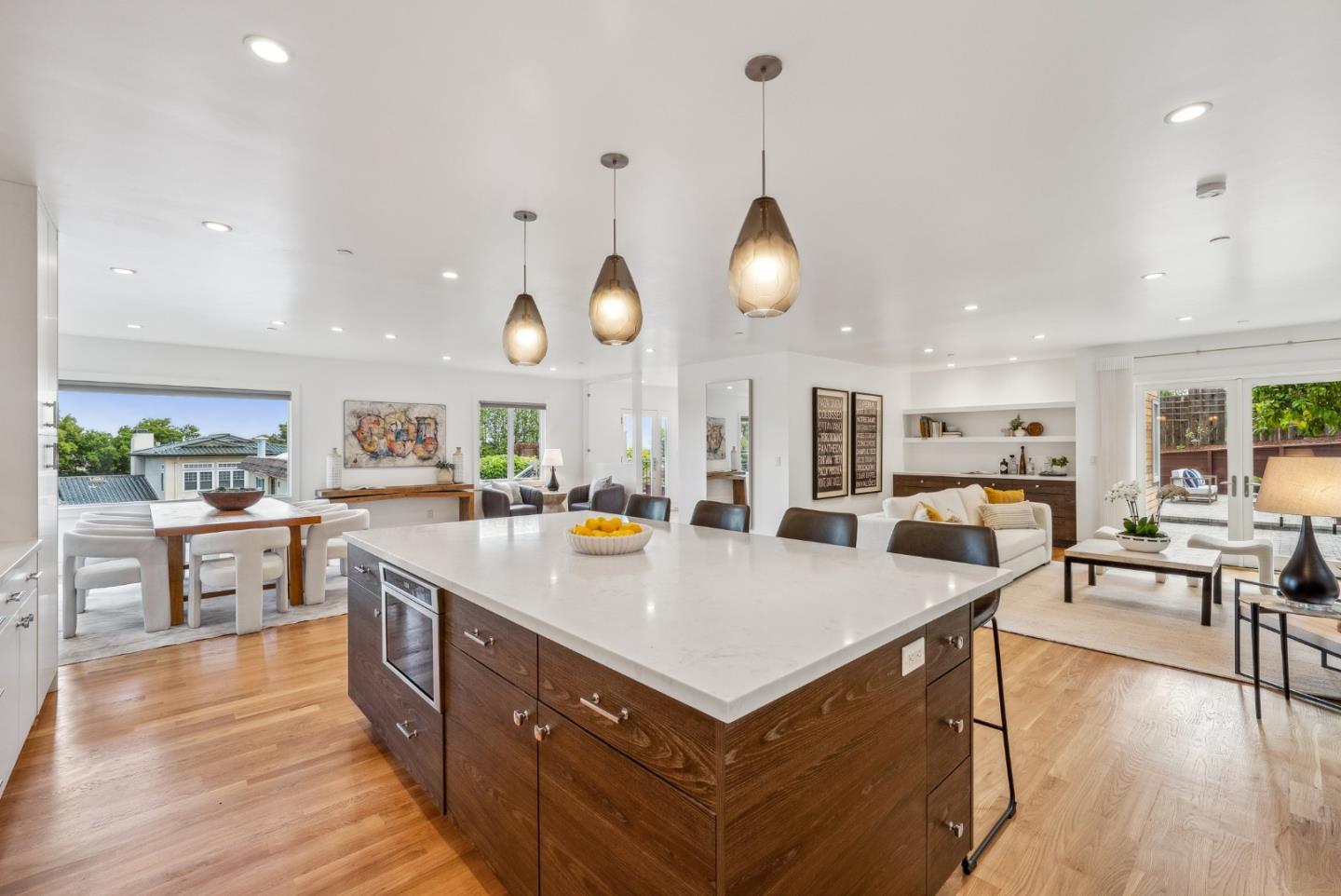 1 Millbrae Circle Millbrae, CA 94030 - Photo 14 of 110 a large kitchen with kitchen island a stove a sink a refrigerator and a dining table with wooden floor