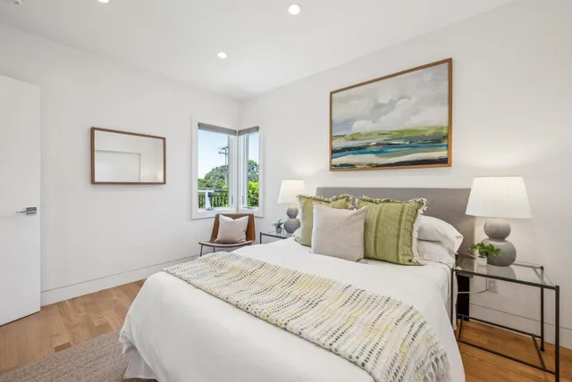 a bathroom with double vanity sink and a mirror