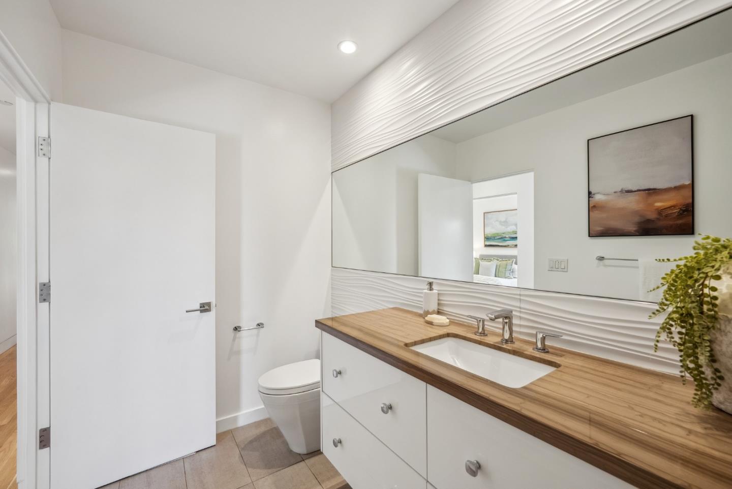 1 Millbrae Circle Millbrae, CA 94030 - Photo 45 of 110 a bathroom with a granite countertop sink a toilet and a large mirror