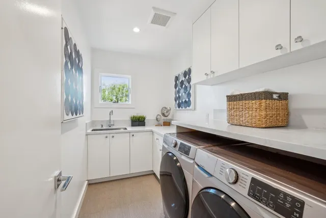 a backyard of a house with table and chairs