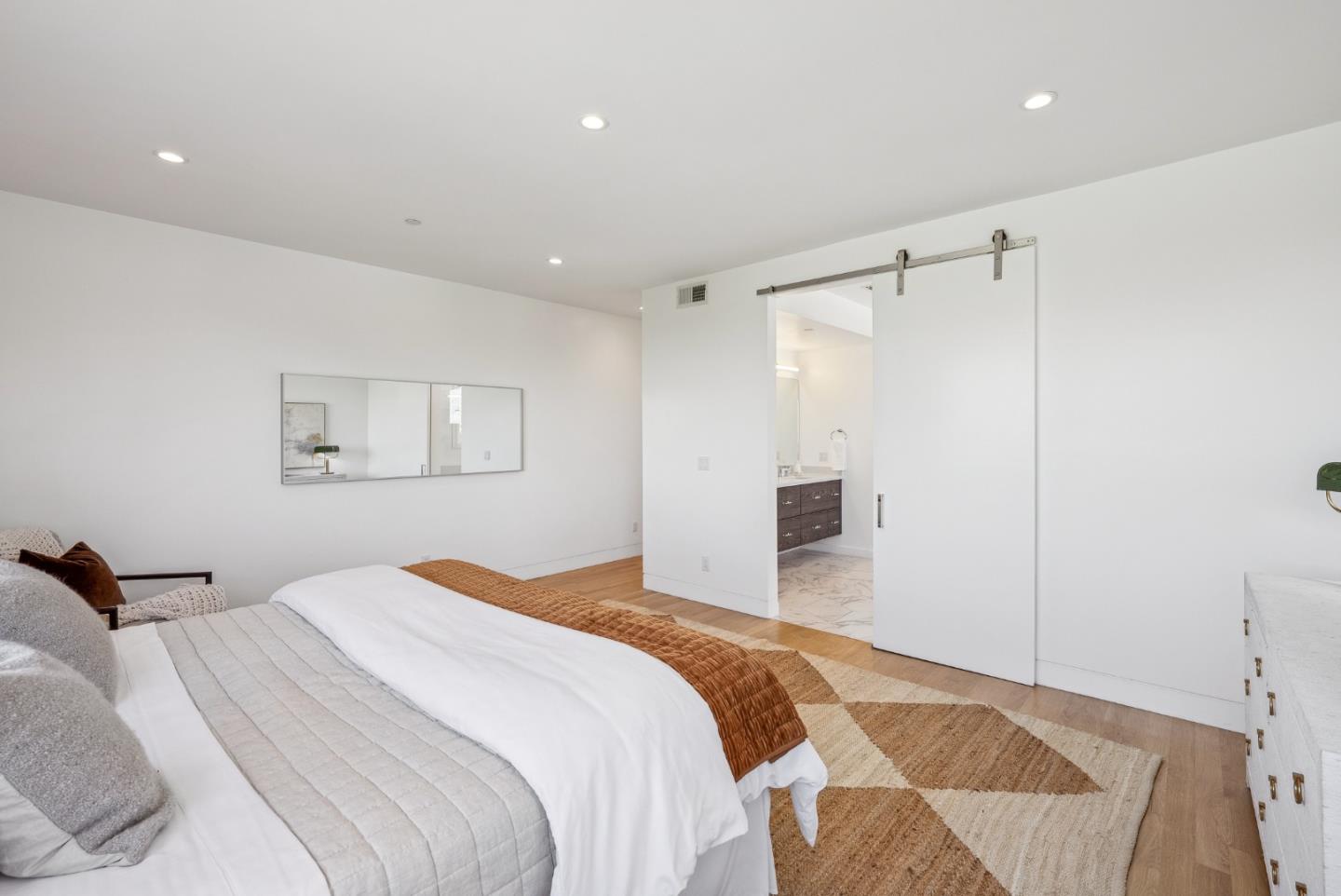 1 Millbrae Circle Millbrae, CA 94030 - Photo 74 of 110 a bedroom with a large bed and a chandelier