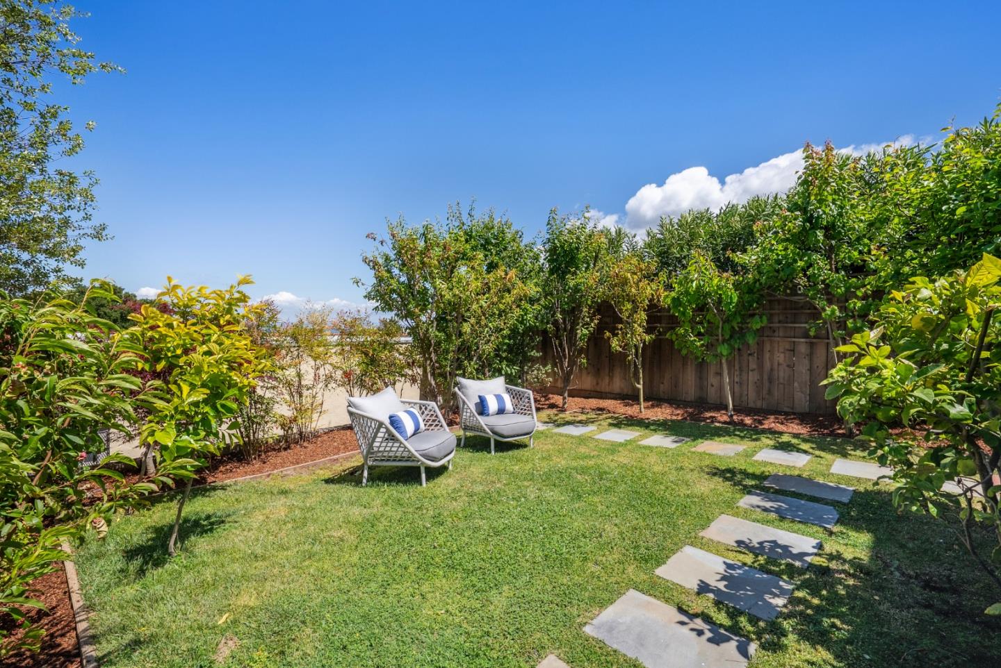1 Millbrae Circle Millbrae, CA 94030 - Photo 95 of 110 a backyard of a house with table and chairs