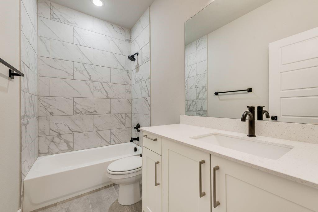 4254 Clovis Street Midlothian, TX 76065 - Photo 13 of 16 a bathroom with a sink a toilet and shower