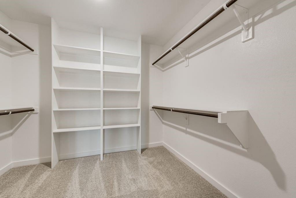 4254 Clovis Street Midlothian, TX 76065 - Photo 8 of 16 a view of walk in closet with empty racks