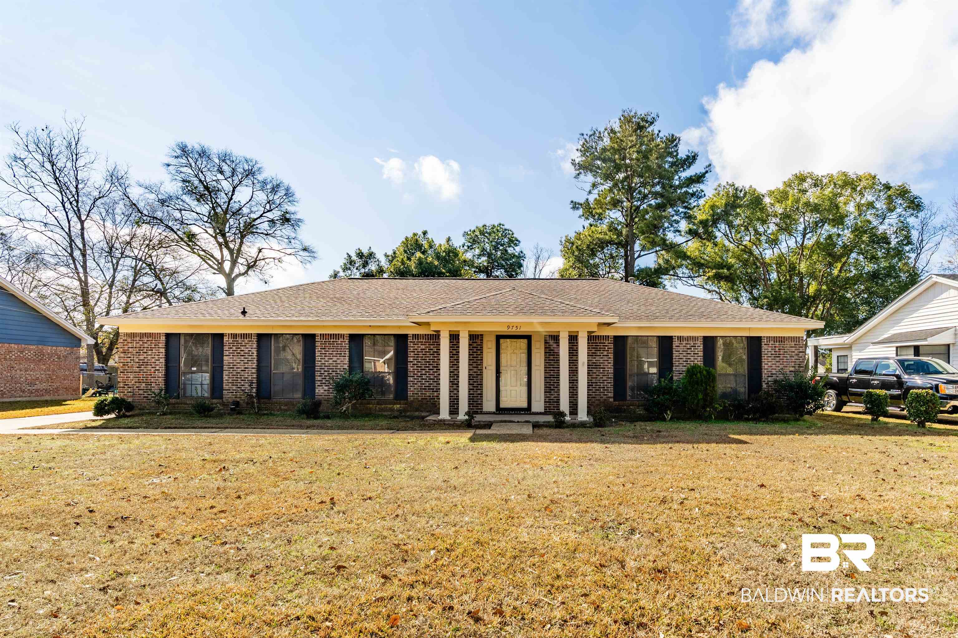 9751 Pine Knoll Road Mobile, AL 36608 - Photo 1 of 36 Ranch-style house with brick siding, a front yard, and roof with shingles