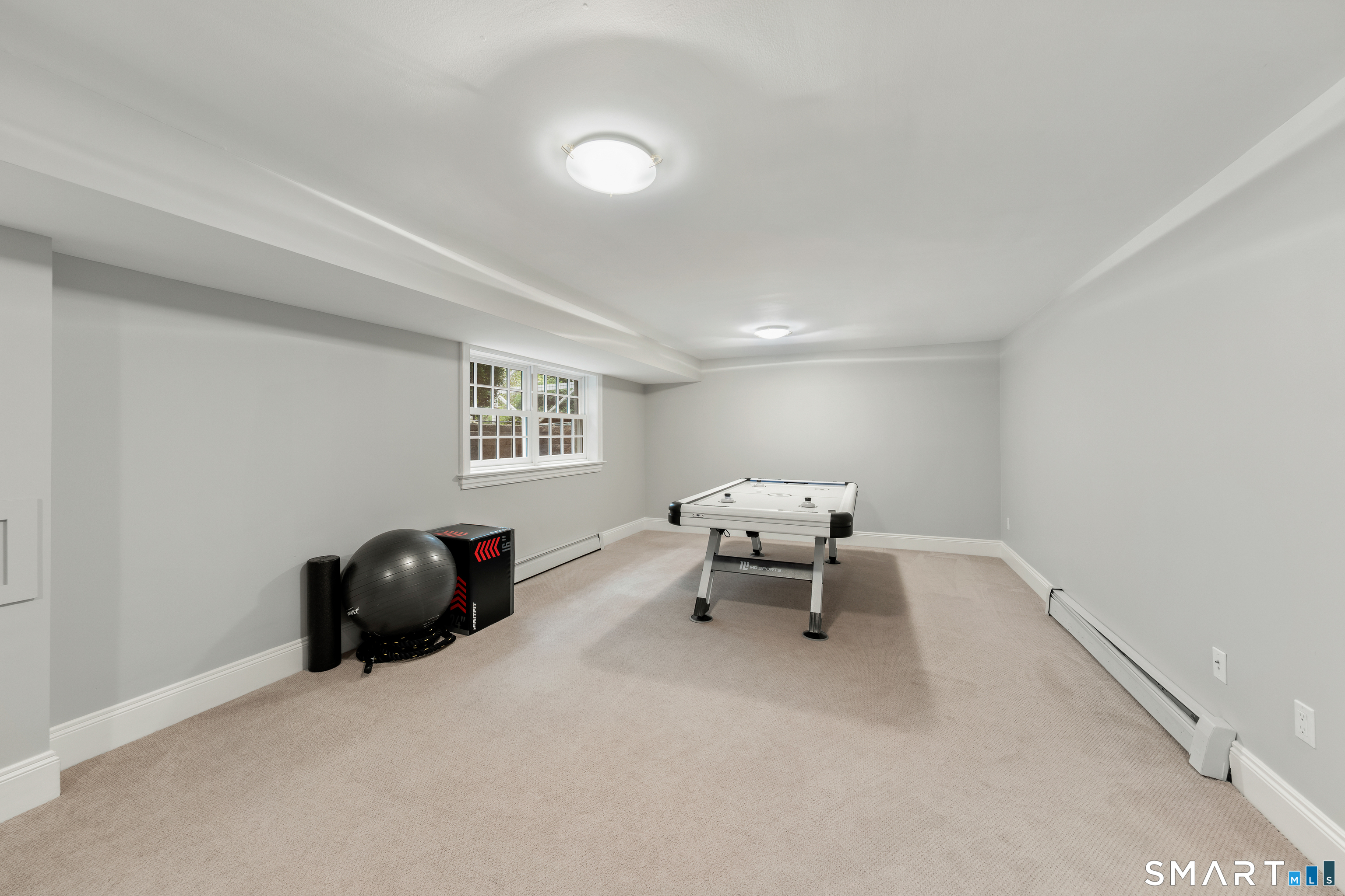 99 Hickok Road New Canaan, CT 06840 - Photo 31 of 39 a bedroom with a bed and a window