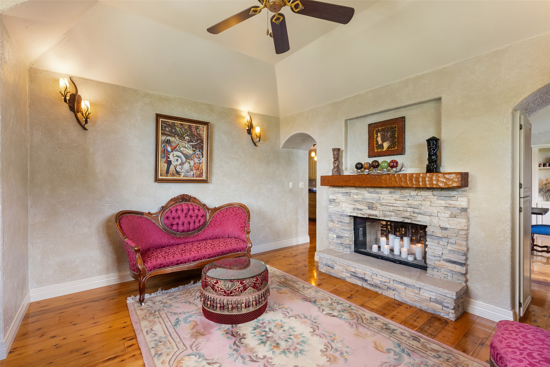 1354 The High Road Austin, TX 78746 - Photo 20 of 40 A striking stone fireplace is the focal point of this warm living space with high ceilings and hardwood floors.