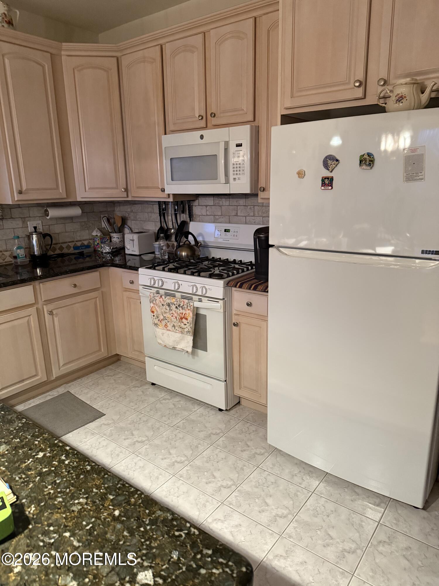 7 Albatross Point Bayville, NJ 08721 - Photo 15 of 56 a white refrigerator freezer sitting in a kitchen