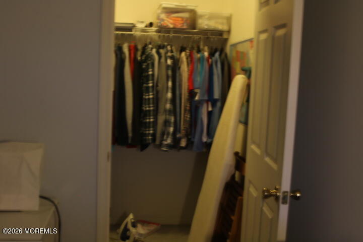 7 Albatross Point Bayville, NJ 08721 - Photo 29 of 56 a view of walk in closet with clothes and shoes