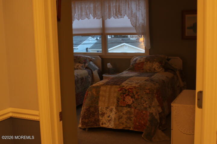 7 Albatross Point Bayville, NJ 08721 - Photo 33 of 56 a bed sitting in a bedroom next to a window