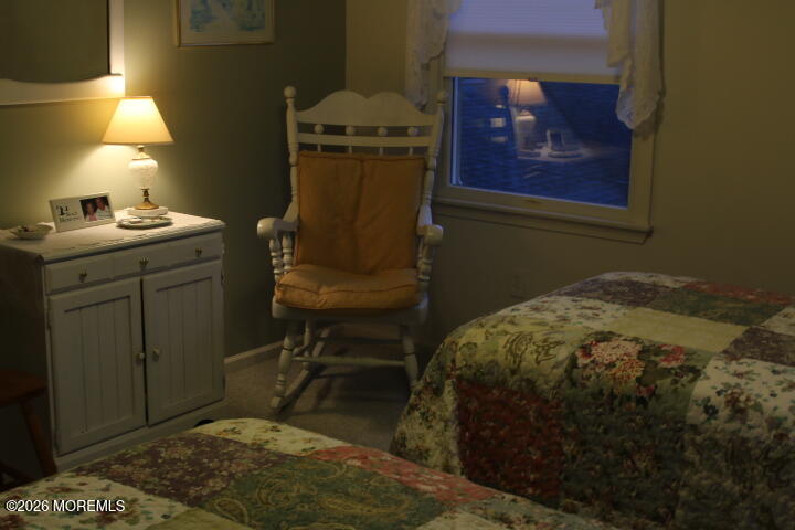 7 Albatross Point Bayville, NJ 08721 - Photo 34 of 56 a bed sitting in a room next to a lamp
