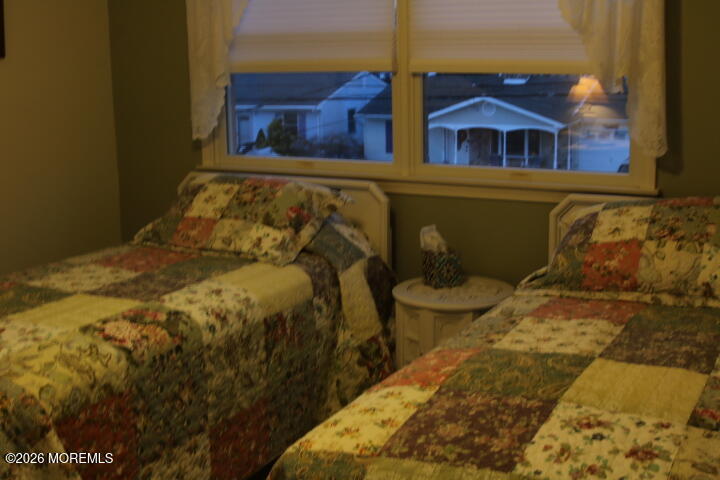 7 Albatross Point Bayville, NJ 08721 - Photo 35 of 56 a bed sitting in a bedroom next to a window