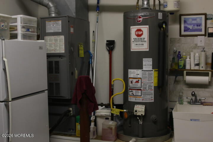 7 Albatross Point Bayville, NJ 08721 - Photo 41 of 56 a room with cabinets and refrigerator