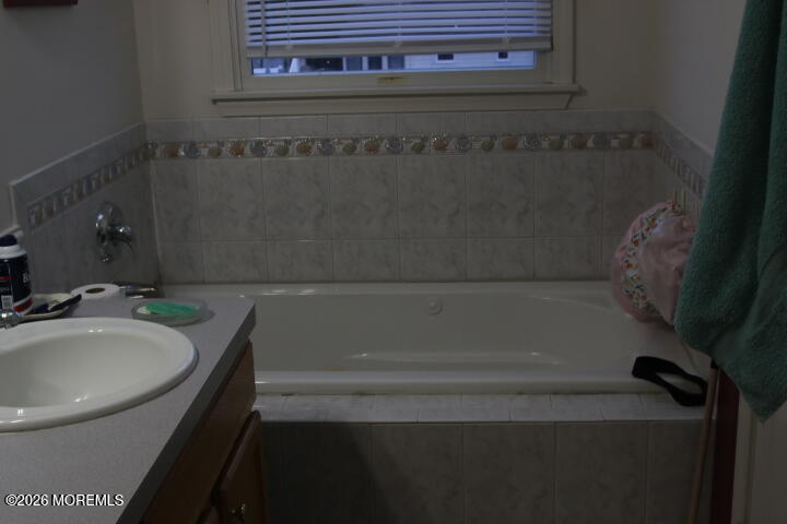 7 Albatross Point Bayville, NJ 08721 - Photo 49 of 56 a bathroom with a bathtub and sink