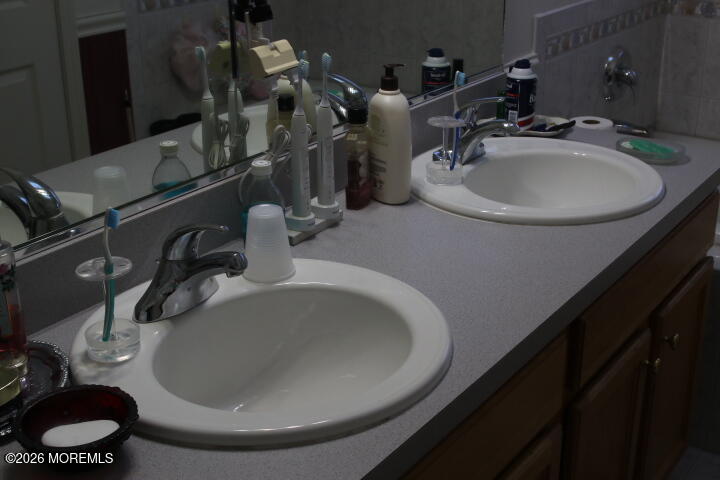 7 Albatross Point Bayville, NJ 08721 - Photo 50 of 56 a bathroom with a sink and a mirror