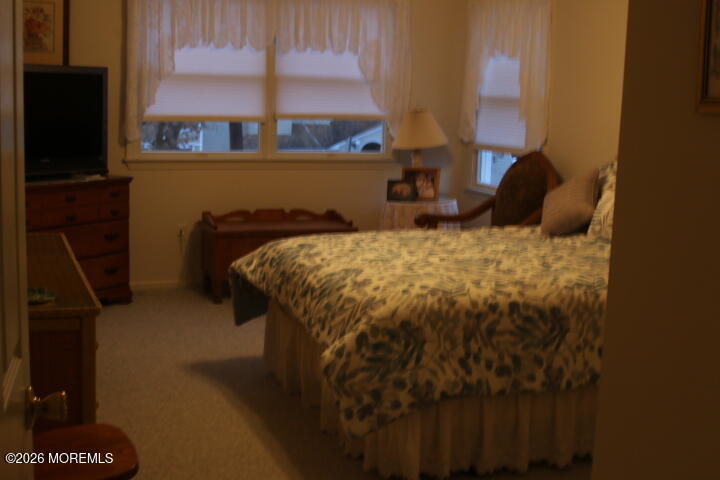 7 Albatross Point Bayville, NJ 08721 - Photo 54 of 56 a bed sitting in a bedroom next to a window