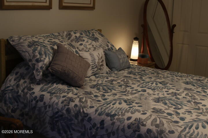 7 Albatross Point Bayville, NJ 08721 - Photo 55 of 56 a bed sitting in a bedroom next to a window