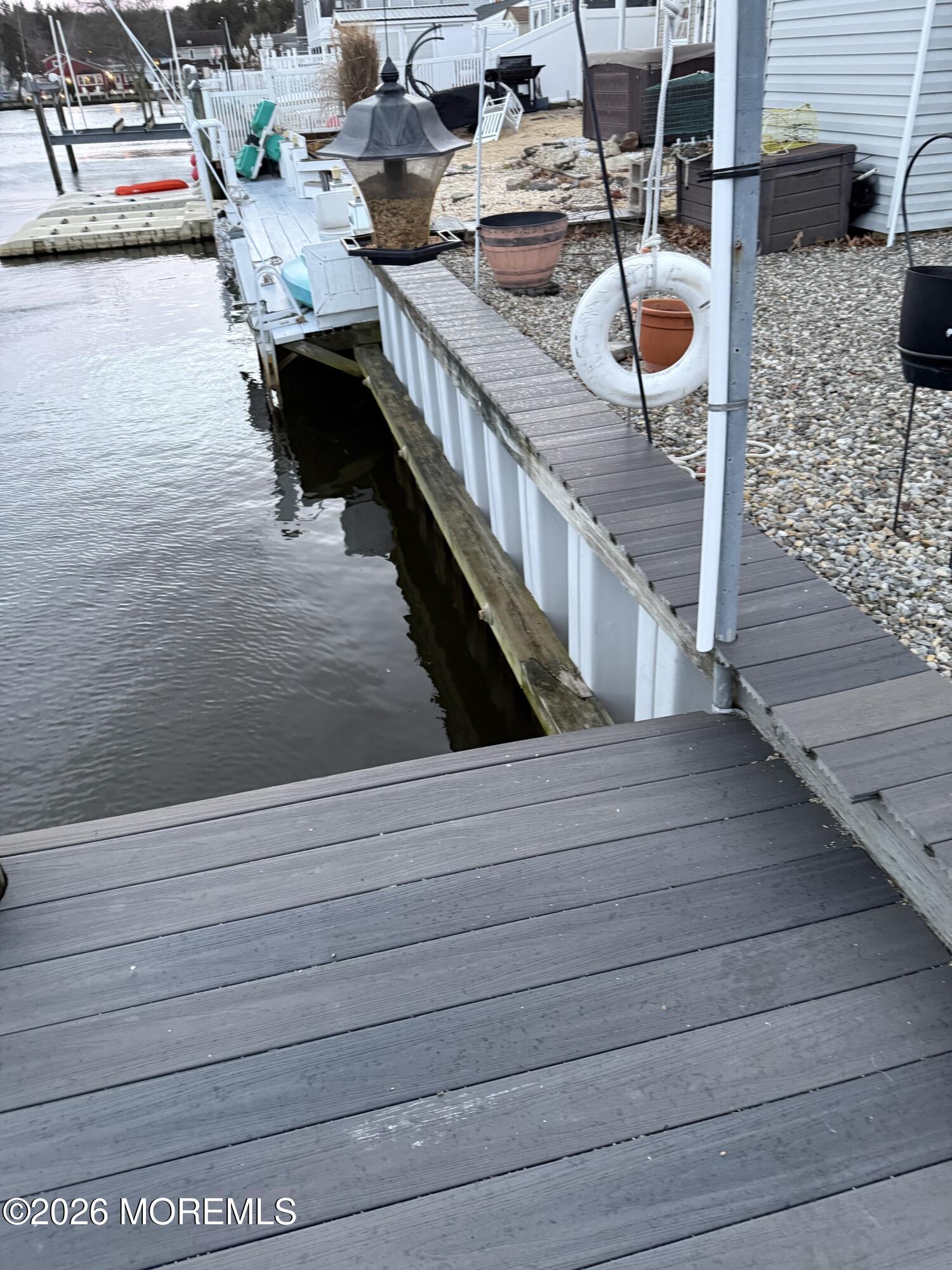 7 Albatross Point Bayville, NJ 08721 - Photo 7 of 56 a terrace with outdoor seating and kitchen view